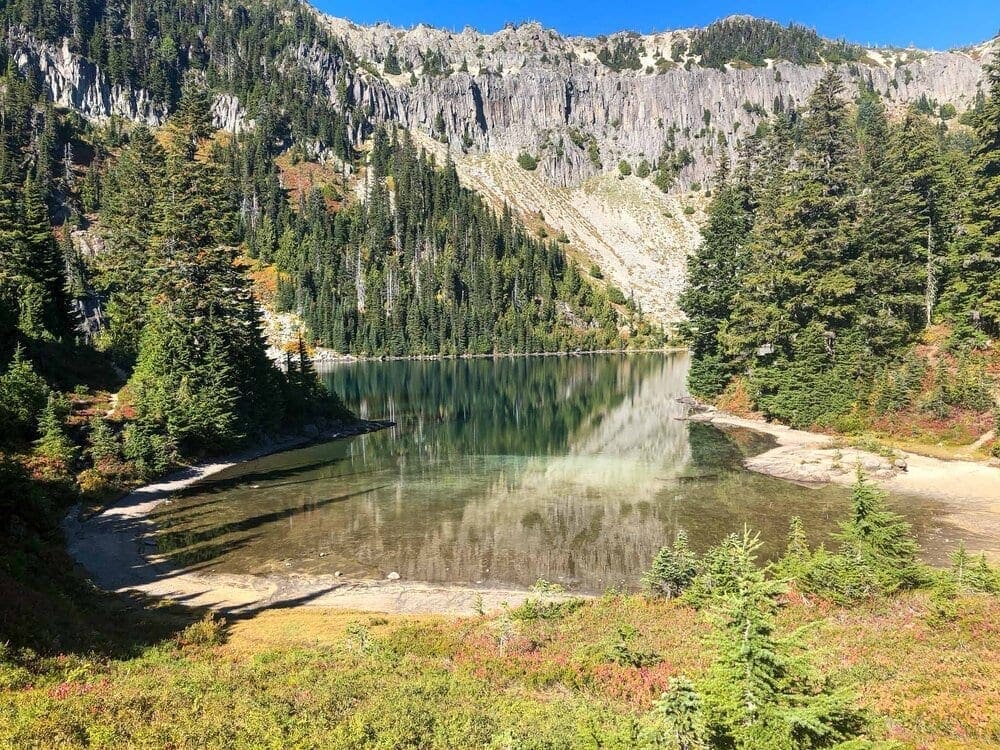 Beautiful reflections and fall colors in Eunice Lake from the Tolmie Peak Trail.