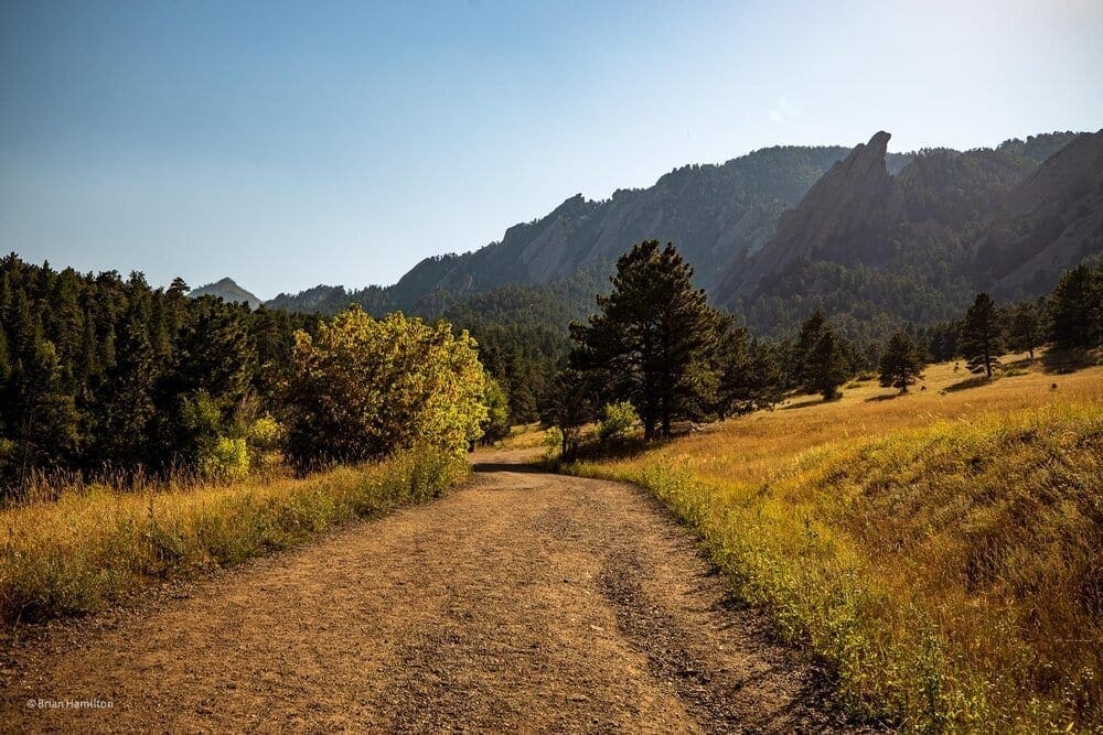 Photo Waypoint: 39.99715, -105.28287. View from trail looking to the south.&nbsp;&nbsp;The famous flatirons are already in the shade as the sun descents in the late afternoon sky. Canon EOS R, Canon RF 15-35mm f/2.8L USM Lens, ISO 100, 24 mm, f/5.6, 1/320 seconds.
