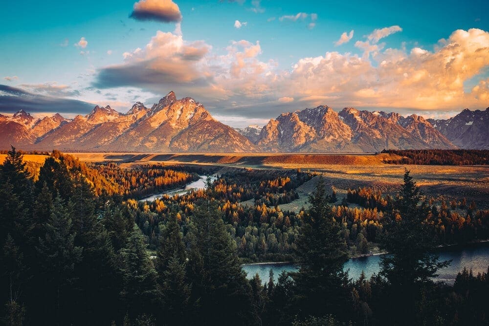 Grand Tetons peak at sunrise with views from the Snake River Overlook near Jackson, Wyoming. Ansel Adams took his iconic photograph here in the 1940's.