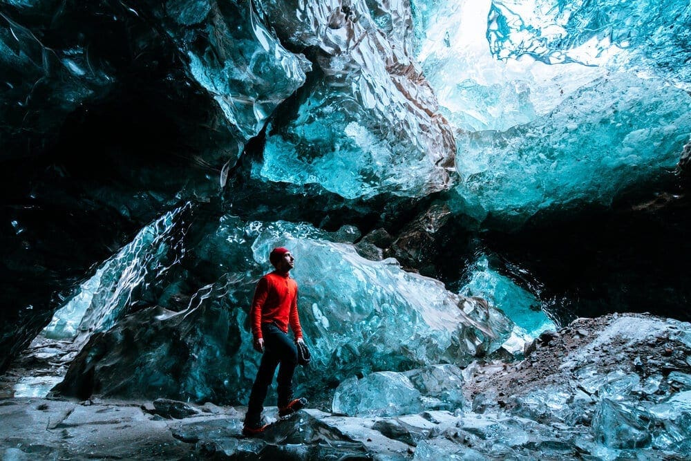 adventurer inside a blue ice cave in iceland (Copy)