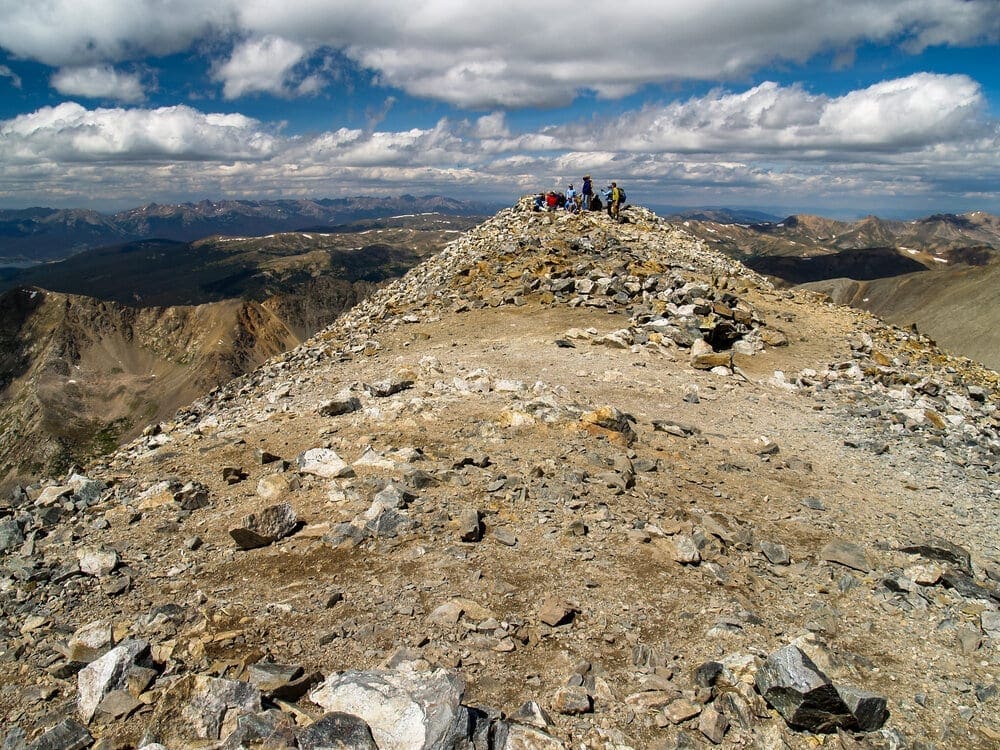Photo 6. Resting on the Summit of Fourteener Grays Peak.