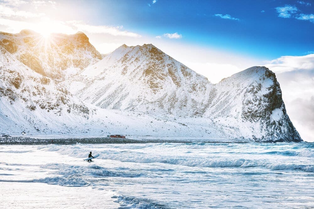 Surfing on picturesque arctic Unstad beach on the Lofoten islands in Norway, an iconic adventure travel destination for surfers all over the world. Unstad&nbsp;is the most famous surf spot in the&nbsp;Lofoten Islands, the most photographed wave in the Arctic Circle and probably the best break in&nbsp;Norway.