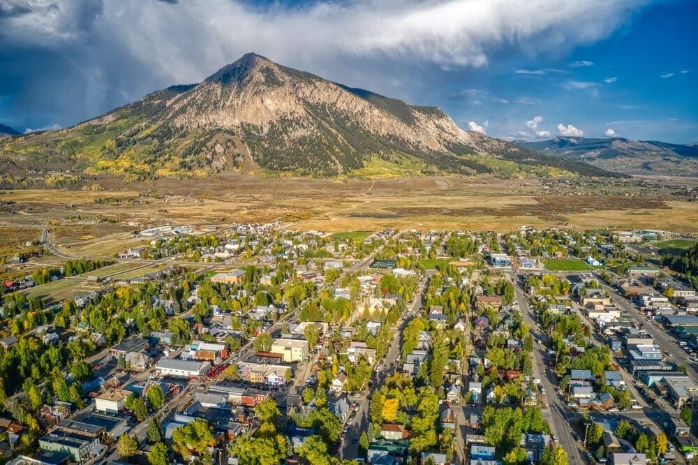 Aerial View of the Popular Adventure Sports Town of Crested Butte, Colorado in Peak Autumn Colors.
