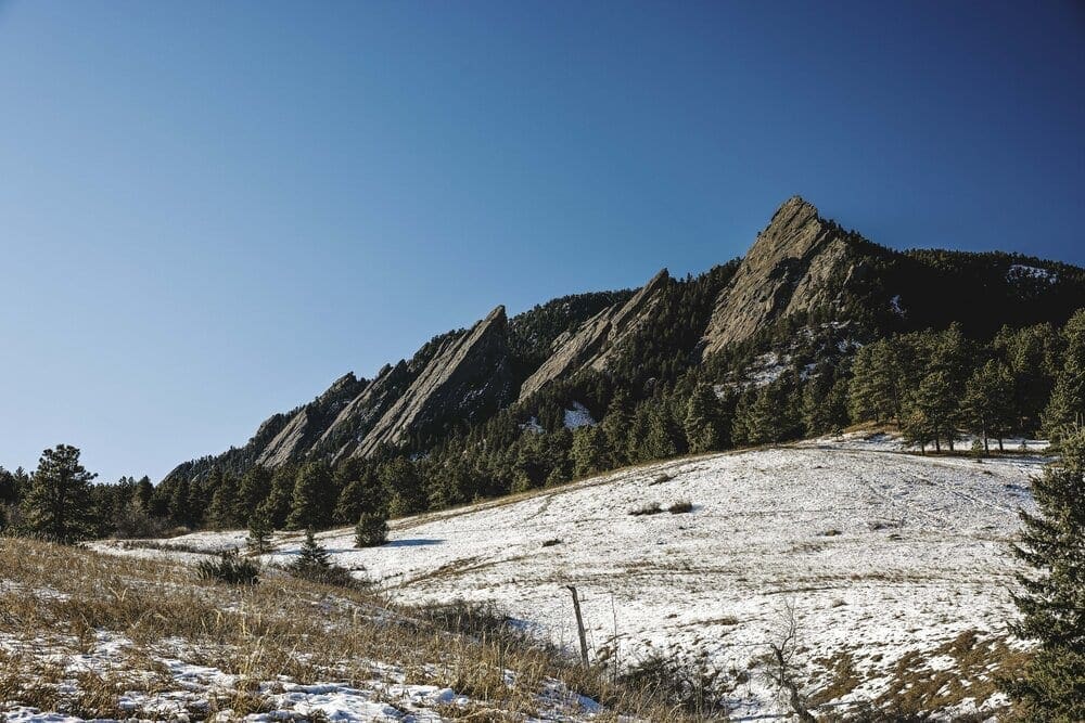 The Flatirons are a popular destination for hiking and climbing! The world-class climbing routes here range in difficulty from beginner to the expert-level sport climb named Made in Time (5.14c). According to guidebook author, Richard Rossiter, the East Face Standard route on the Third Flatiron 