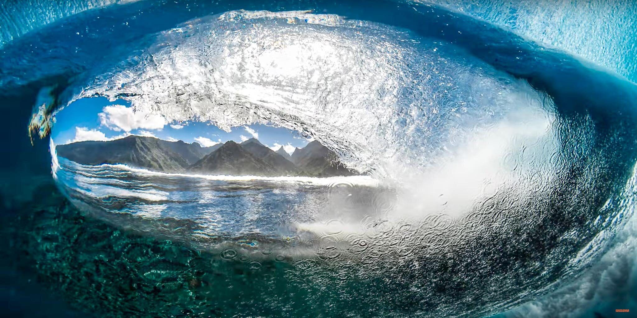 One day, Ben realized he could actually shoot the land from underwater, through a moving wave! With each wave bringing a new perspective, the familiar Tahitian landscape was getting a new look as well. It’s almost literally a natural fish-eye lens. Photo by Ben Thouard and ROAM Media.
