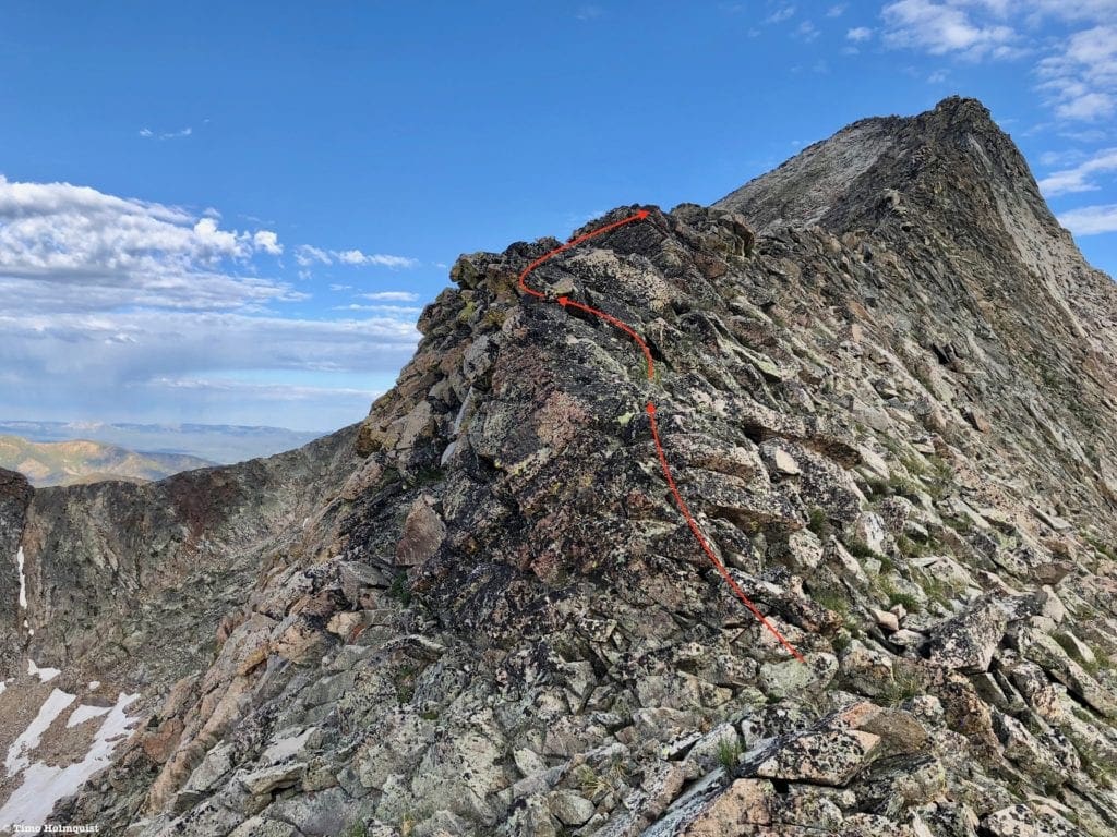 The second section of the ridge scramble begins just beyond the highest red arrow.