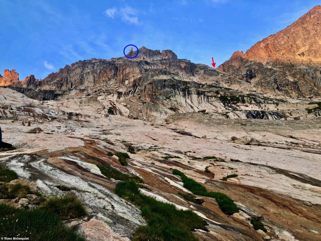 The Stone Man (blue circle), in relation to the pass (red arrow).
