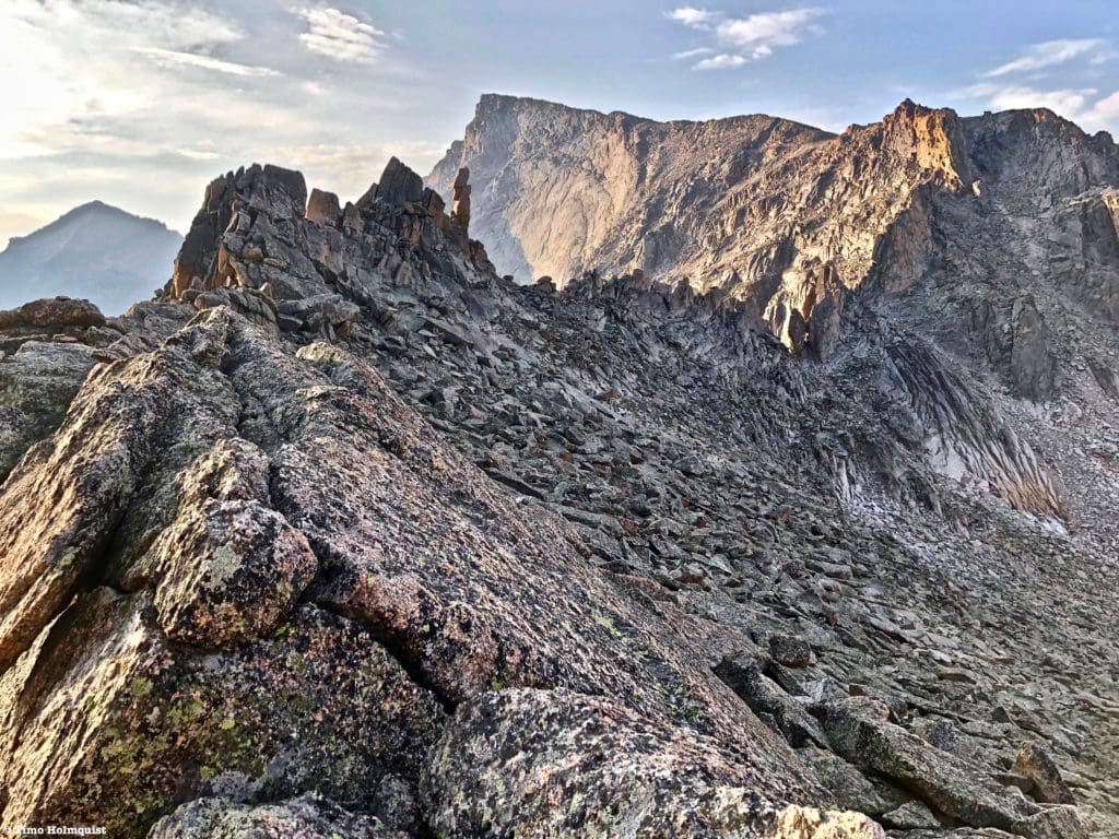 Following the ridgeline south, you can see the Stoneman rock formation and the hulking northern face of Chiefs Head Peak. The ridge featured is part of the Continental Divide.