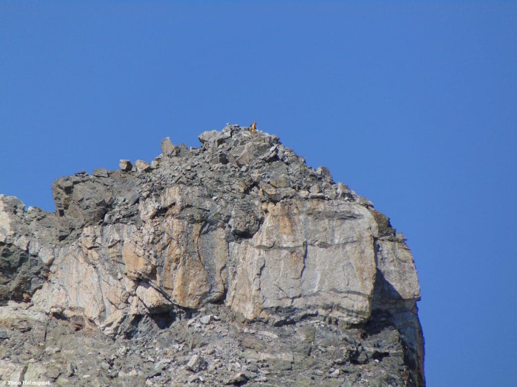 Climbers on the dramatic and picturesque summit of Navajo Peak.